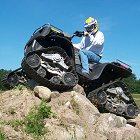 Litefoot ATV tracks on a quad on rocks - Photo
