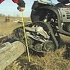 Litefoot ATV tracks on an ATV clearing obstacles - Photo